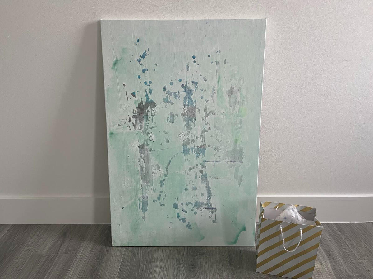Pale green abstract canvas with blue and gray paint marks